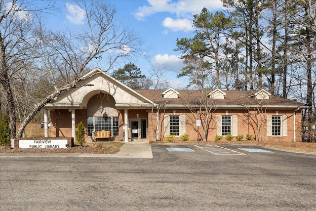 view of property with uncovered parking