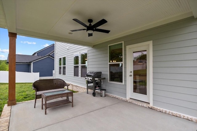 view of patio / terrace with ceiling fan, fence, and grilling area