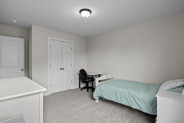 carpeted bedroom with a closet