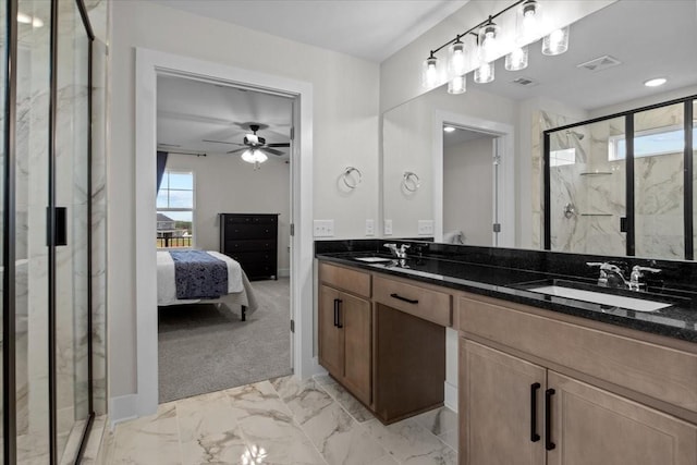 ensuite bathroom featuring a marble finish shower, a sink, ensuite bathroom, visible vents, and marble finish floor