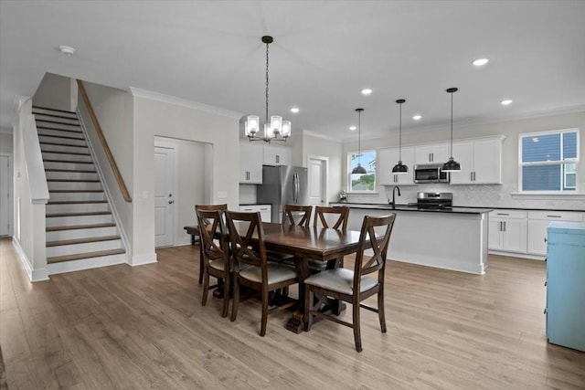 dining space with ornamental molding, light wood-style floors, stairs, recessed lighting, and a chandelier