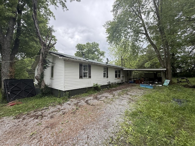 exterior space featuring crawl space and driveway