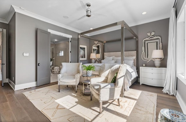 bedroom with crown molding, baseboards, visible vents, and wood finished floors