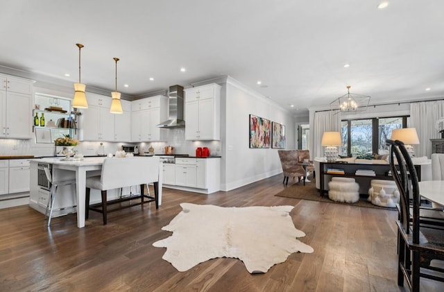 interior space featuring dark wood-style flooring, a notable chandelier, baseboards, and recessed lighting