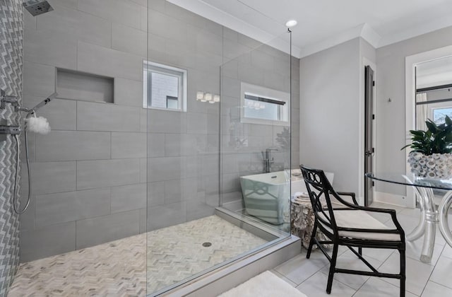bathroom featuring a soaking tub, tile patterned floors, and tiled shower