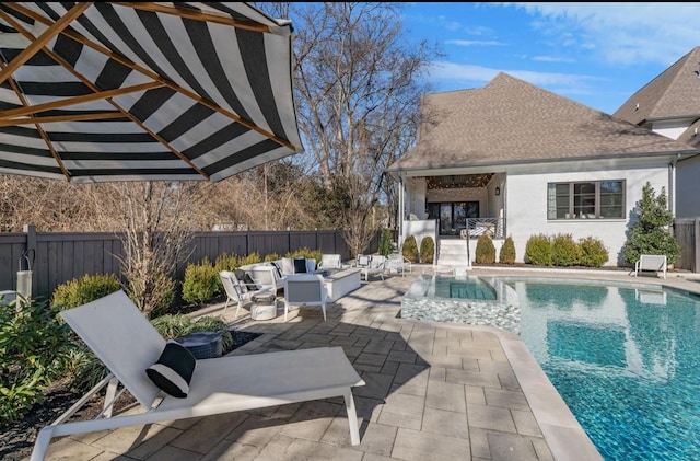 view of pool with a fenced backyard, a patio, a fenced in pool, and outdoor lounge area