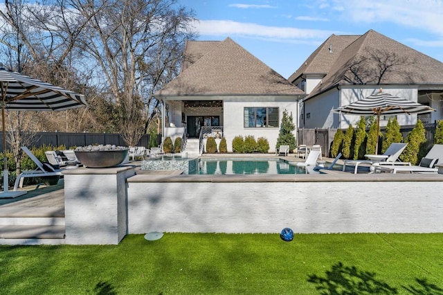view of pool featuring a patio area, a fenced in pool, and fence