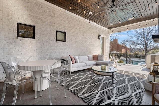 view of patio with an outdoor hangout area, a fenced in pool, and ceiling fan