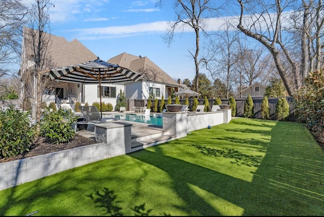 view of swimming pool featuring a fenced backyard, a patio area, a fenced in pool, and a lawn