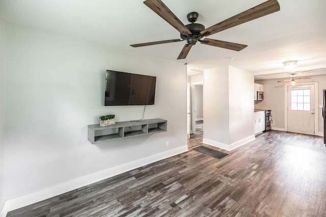709 Ann Ave, Gallatin, TN 37066 - unfurnished living room featuring dark wood-type flooring, baseboards, and a ceiling fan