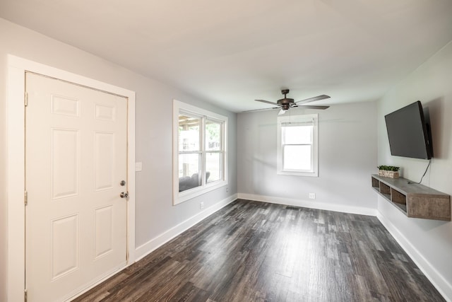 709 Ann Ave, Gallatin, TN 37066 - unfurnished living room with baseboards, dark wood-style flooring, and ceiling fan