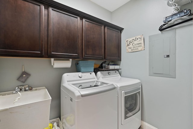 clothes washing area featuring separate washer and dryer, a sink, cabinet space, and electric panel