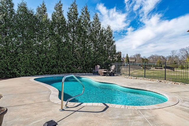 view of pool featuring a patio, a fenced in pool, and a fenced backyard