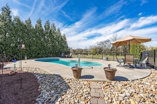 view of pool featuring a patio, fence, and a fenced in pool