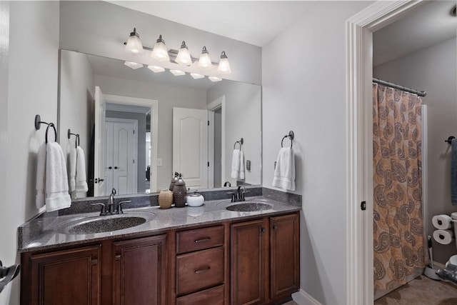 full bath with double vanity and a sink