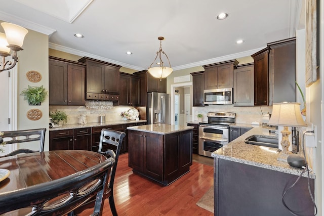 kitchen featuring dark brown cabinets, backsplash, crown molding, and appliances with stainless steel finishes