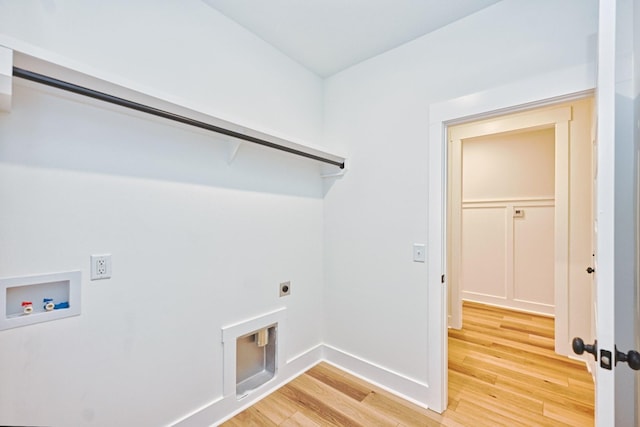 laundry area with laundry area, light wood-style flooring, electric dryer hookup, baseboards, and hookup for a washing machine