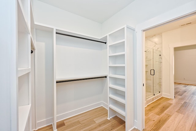 spacious closet with visible vents and light wood-style floors