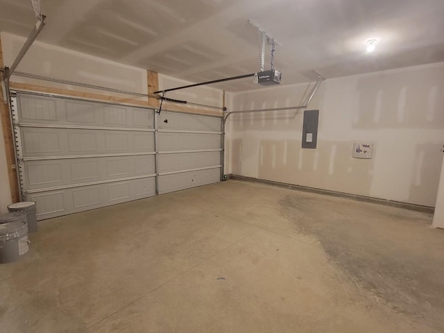 garage featuring electric panel and a garage door opener