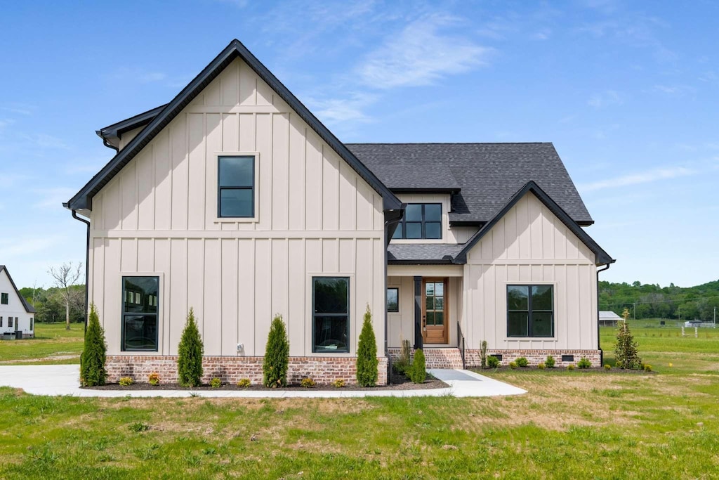3263 E Jefferson Pike, Lascassas, TN 37085 - modern farmhouse style home featuring board and batten siding, brick siding, crawl space, a front yard, and roof with shingles