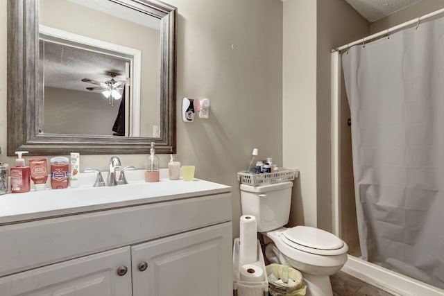 608 Dean Rd, Clarksville, TN 37040 - bathroom with a ceiling fan, a stall shower, a textured ceiling, toilet, and vanity