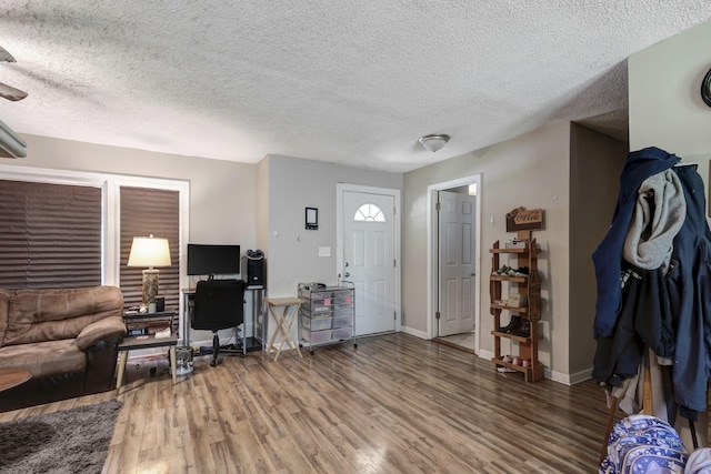 608 Dean Rd, Clarksville, TN 37040 - entryway featuring a textured ceiling, baseboards, and wood finished floors
