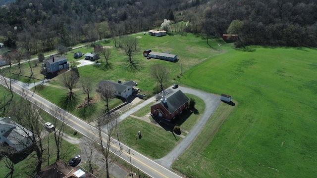 bird's eye view featuring a rural view and a view of trees