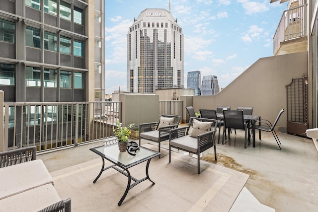 415 Church St Unit 1009, Nashville, TN 37219 - view of patio / terrace featuring a view of city and outdoor dining area