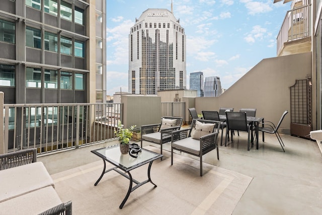 415 Church St Unit 1009, Nashville, TN 37219 - view of patio featuring a city view and outdoor dining space