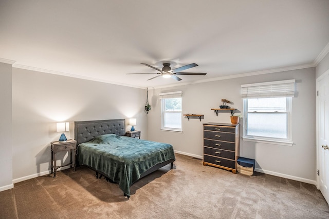 bedroom with ornamental molding, baseboards, carpet flooring, and ceiling fan