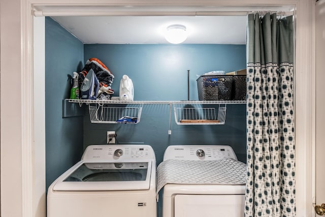laundry room featuring washing machine and clothes dryer