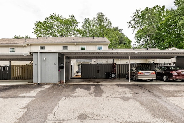 covered parking lot with fence
