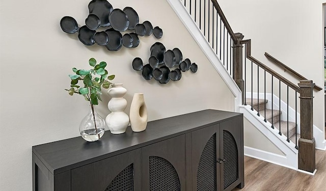 room details featuring baseboards and wood finished floors