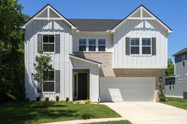 138 W Cassa Way, Mount Juliet, TN 37122 - view of front facade featuring board and batten siding, a front lawn, an attached garage, roof with shingles, and concrete driveway
