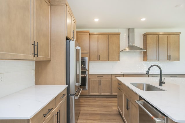 138 W Cassa Way, Mount Juliet, TN 37122 - kitchen with wall chimney range hood, appliances with stainless steel finishes, a sink, backsplash, and wood finished floors