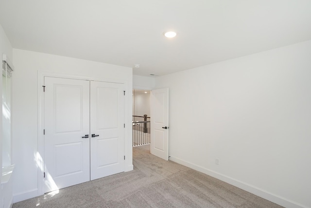 138 W Cassa Way, Mount Juliet, TN 37122 - unfurnished bedroom featuring a closet, baseboards, and light carpet