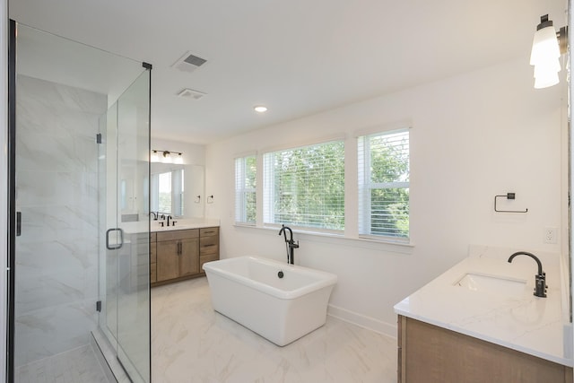138 W Cassa Way, Mount Juliet, TN 37122 - full bath featuring marble look tile flooring, vanity, a marble finish shower, a freestanding tub, and baseboards