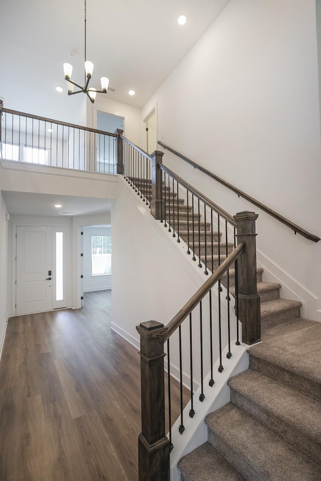 138 W Cassa Way, Mount Juliet, TN 37122 - stairs featuring wood finished floors, a chandelier, baseboards, recessed lighting, and a towering ceiling