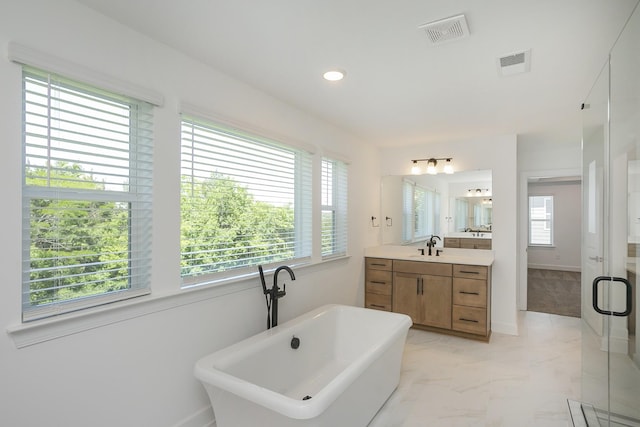 138 W Cassa Way, Mount Juliet, TN 37122 - full bathroom featuring plenty of natural light, a soaking tub, vanity, marble finish flooring, and recessed lighting