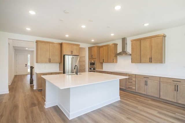 138 W Cassa Way, Mount Juliet, TN 37122 - kitchen with wall chimney range hood, stainless steel appliances, a center island with sink, light countertops, and a sink