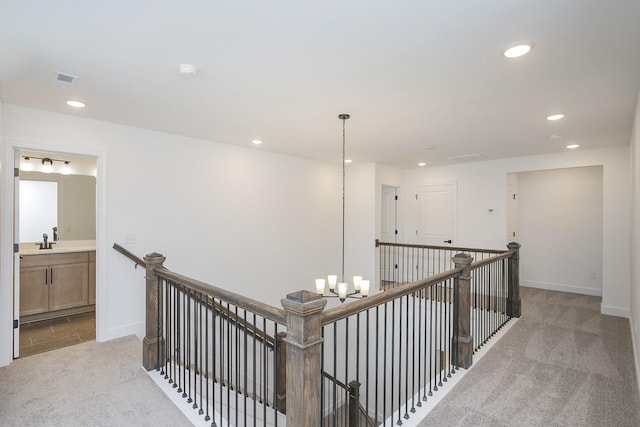 138 W Cassa Way, Mount Juliet, TN 37122 - hall with carpet floors, an upstairs landing, recessed lighting, baseboards, and a sink