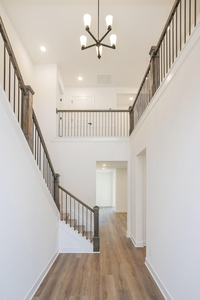 138 W Cassa Way, Mount Juliet, TN 37122 - stairs featuring a chandelier, wood finished floors, a high ceiling, baseboards, and recessed lighting