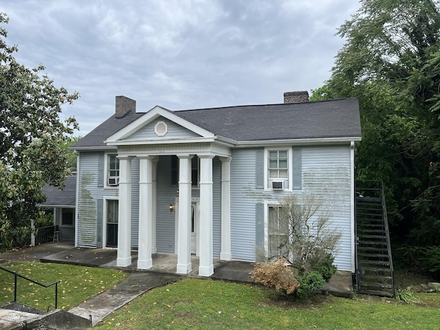 613 W 7th St, Columbia, TN 38401 - greek revival house with a chimney, fence, a shingled roof, a front yard, and a porch