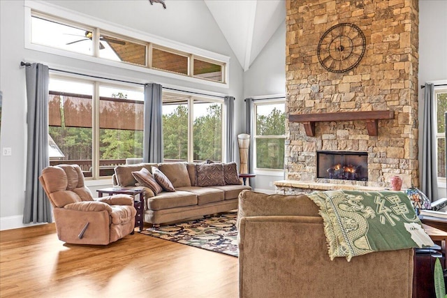 1520 Raulston Falls Rd, Jasper, TN 37347 - living room with baseboards, wood finished floors, a fireplace, and high vaulted ceiling