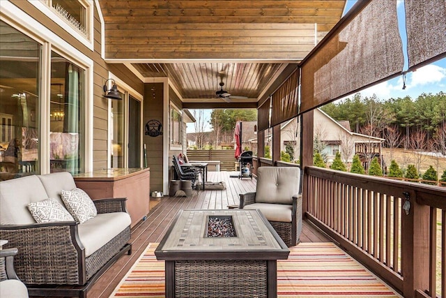 1520 Raulston Falls Rd, Jasper, TN 37347 - wooden terrace with an outdoor living space with a fire pit and a ceiling fan