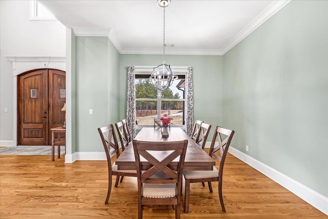 1520 Raulston Falls Rd, Jasper, TN 37347 - dining room featuring light wood finished floors, an inviting chandelier, baseboards, and ornamental molding