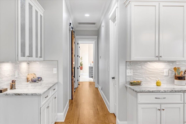 1520 Raulston Falls Rd, Jasper, TN 37347 - corridor featuring baseboards, ornamental molding, visible vents, and light wood-type flooring