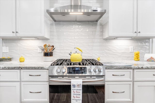 1520 Raulston Falls Rd, Jasper, TN 37347 - kitchen featuring white cabinets, stainless steel range with gas stovetop, tasteful backsplash, and extractor fan