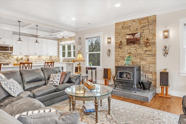 234 Lookout View Dr, Jasper, TN 37347 - living room featuring wood finished floors, coffered ceiling, beam ceiling, baseboards, and a wood stove