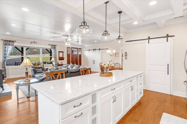 234 Lookout View Dr, Jasper, TN 37347 - kitchen with a barn door, a center island, decorative light fixtures, coffered ceiling, and light wood-style floors